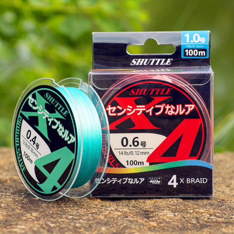 Close-up view of Topline Tackle fishing line spool packaging with clear box and product label"