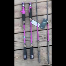 Angler using Topline Barbie Pink slow jigging rod on a boat for offshore fishing