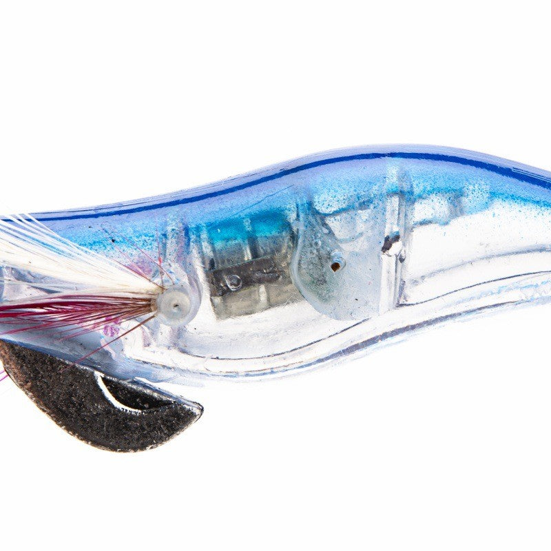 Angler using Topline LED squid jig during a peaceful night fishing trip on a boat