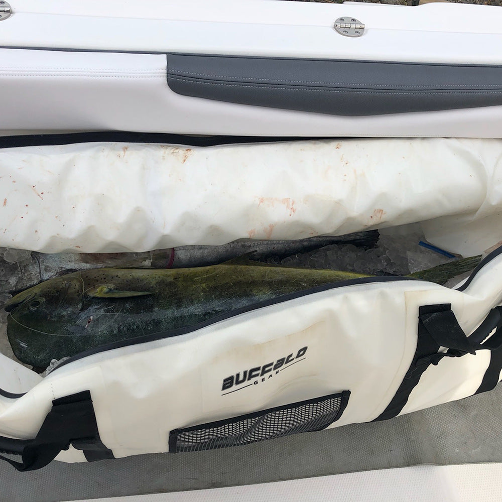 Anglers storing their catch in a large Topline insulated fish bag during deep sea tuna fishing.