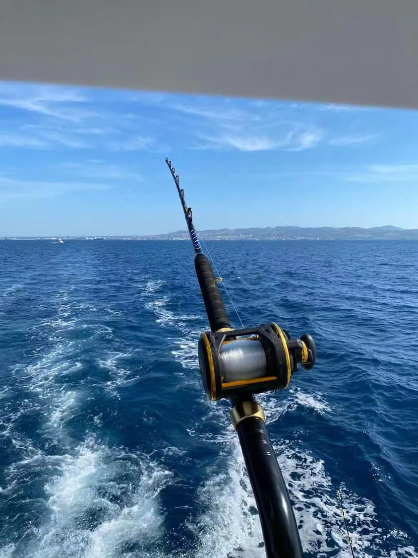  Rod mounted on boat rod holder during deep sea trolling.

